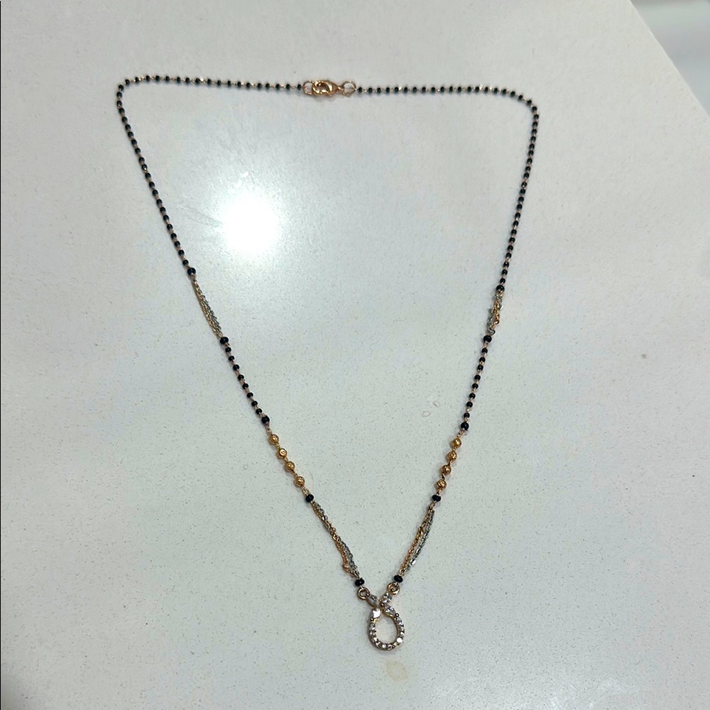 Elegant Gold and Black Necklace
